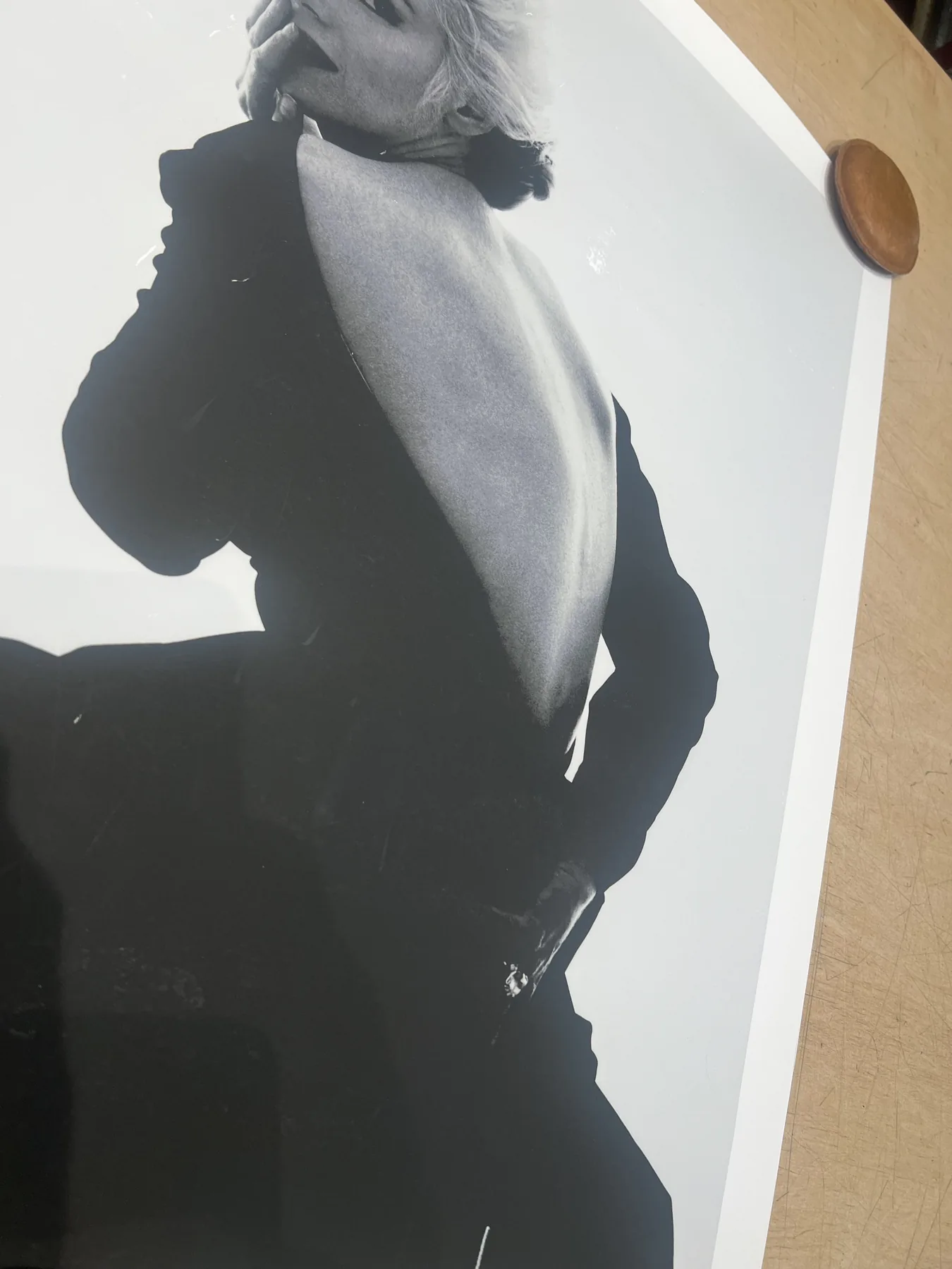 Black-and-white fashion photograph being prepared for framing.